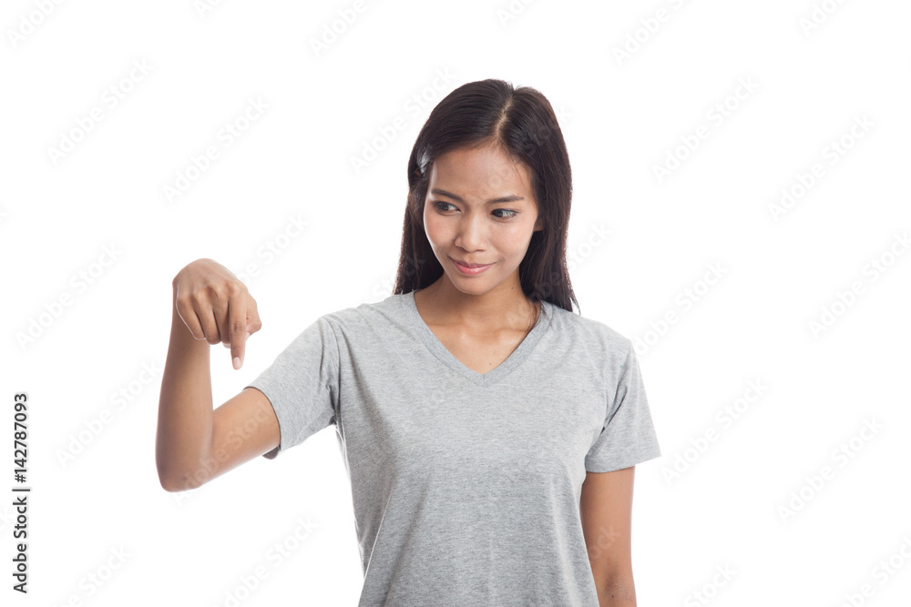 Beautiful young Asian woman point down to blank space. Beautiful young Asian woman point down to blank space.