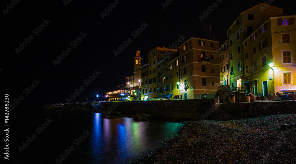GENOA (GENOVA), ITALY, MARCH 29, 2017 - Genoa (Genova) Boccadasse by night, a fishing village and colorful houses GENOA (GENOVA), ITALY, MARCH 29, 2017 - Genoa (Genova) Boccadasse by night, a fishing village and colorful houses