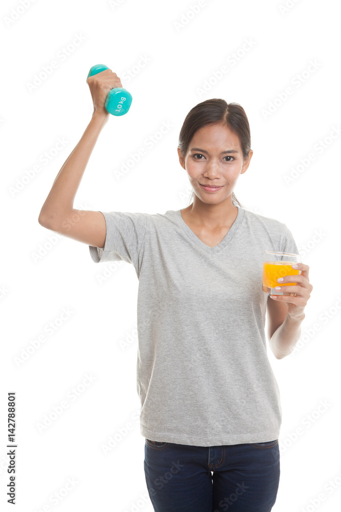 Young Asian woman with dumbbell drink orange juice. Young Asian woman with dumbbell drink orange juice.