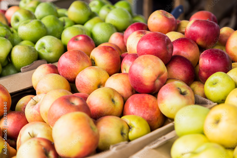 Green, red and yellow apples on the market. Green, red and yellow apples on the market.