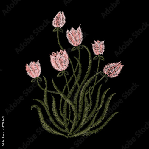 Embroidery trend floral pattern with tulips in simplistic style. Vector fashion bouquet of flowers sign on black background for clothing design.