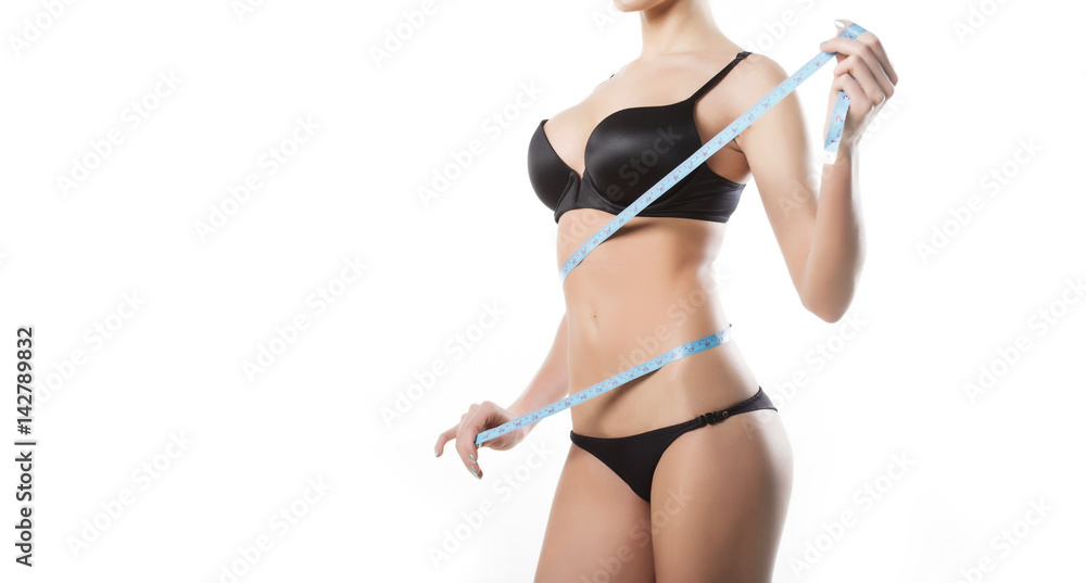 Naklejka premium Beautiful slim body of woman in studio on the white background