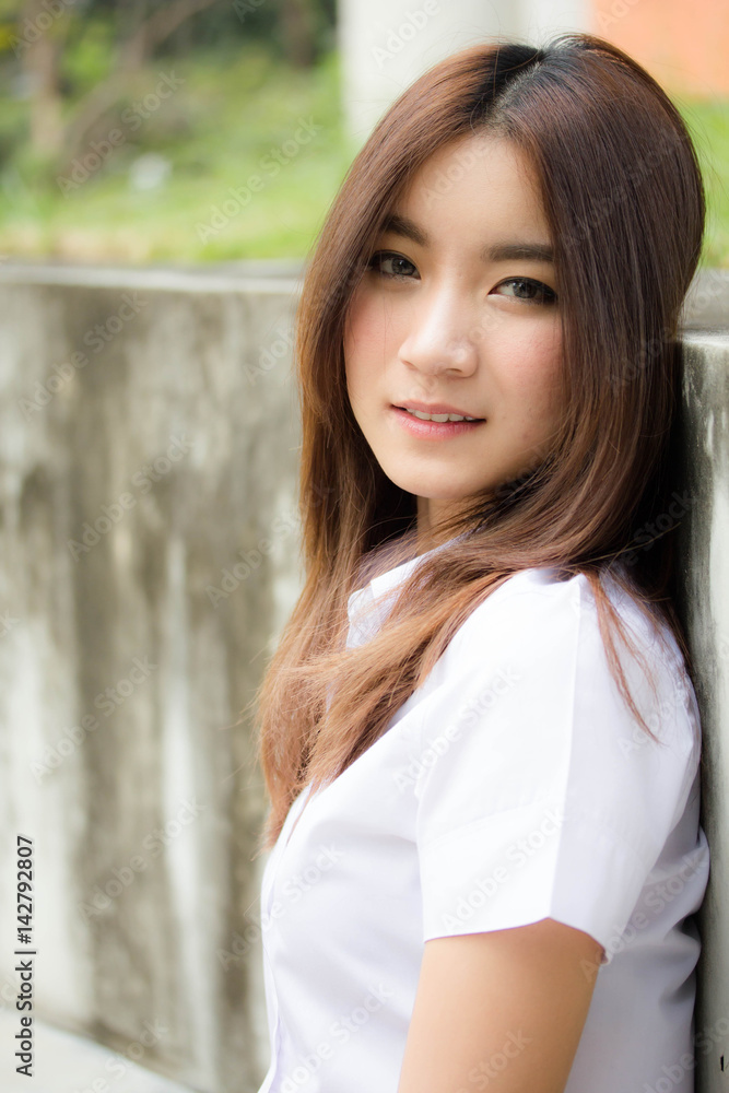 Portrait of thai adult student university uniform beautiful girl relax and smile Portrait of thai adult student university uniform beautiful girl relax and smile
