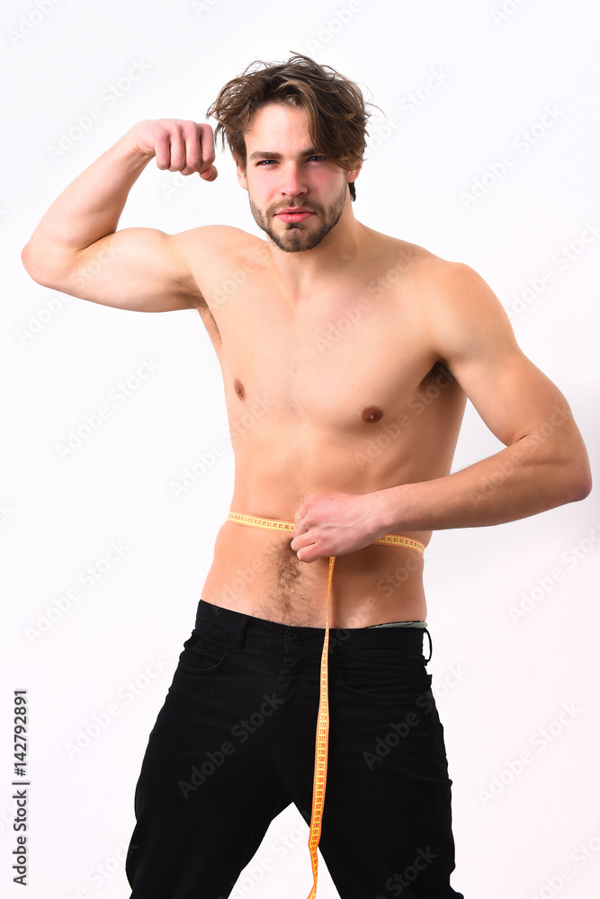 Caucasian sexy young macho uses measuring tape Caucasian sexy young macho uses measuring tape