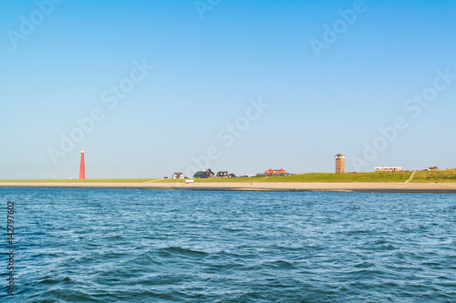 Tableau sur toile Lighthouse at North Sea coast, Huisduinen, Den Helder, Netherlan