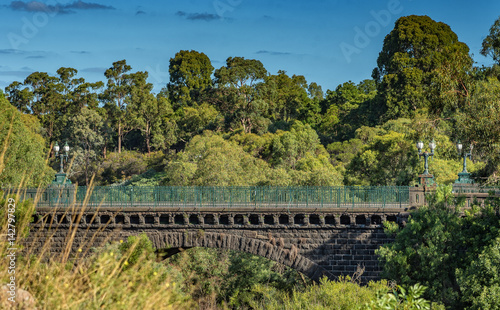 A Victorian era stone arch bridge over Merri Creek in Fairfield, Australia