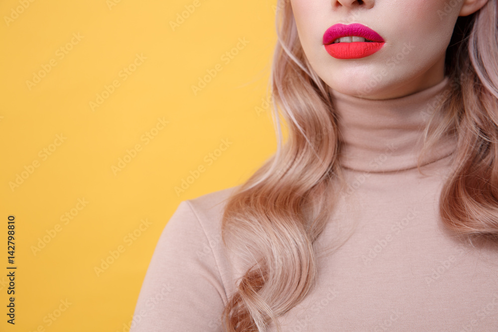 Cropped photo of young blonde lady with bright makeup lips Cropped photo of young blonde lady with bright makeup lips