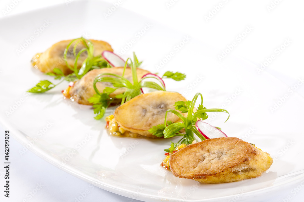Banana canapes with spicy cornmeal 