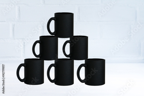 Wallpaper Mural Stack of black simple form mugs. Concept of coffee, coffee break, restaurant, coffee time. Copy space. Torontodigital.ca