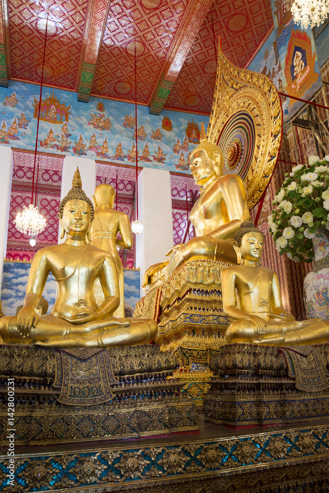 Sculpture of a seated Buddha on the altar of a buddhist temple of Wat Chanasongkram. Bangkok, Thailand