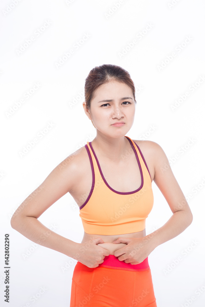 Sad asian woman hand holding or pinching fat body belly paunch Sad asian woman hand holding or pinching fat body belly paunch