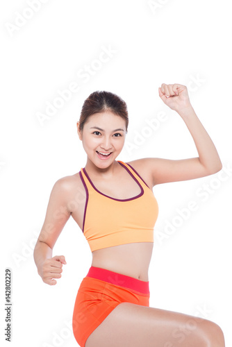 Weight loss concept. Cheerful young exercising woman, isolated over white background © makistock