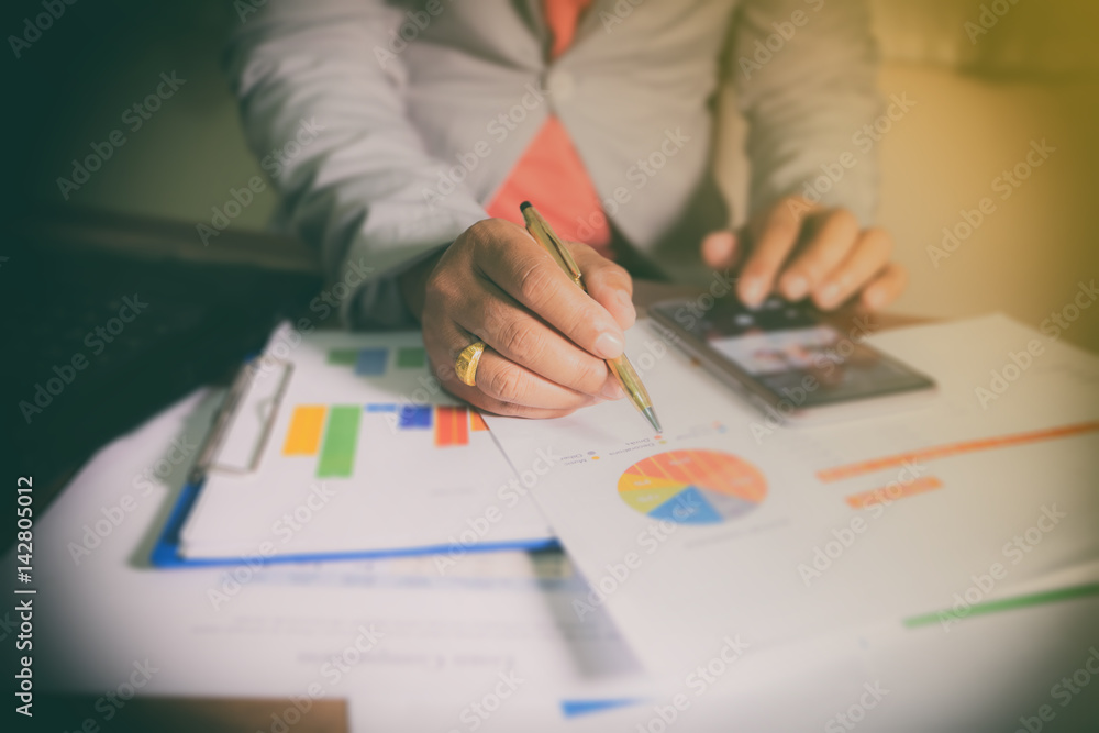 Business man working and analysis graphics at office Business man working and analysis graphics at office