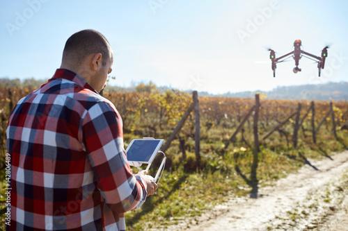 Man remote control flying drone