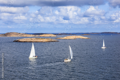 Sailboats at sea in the rocky archipelago