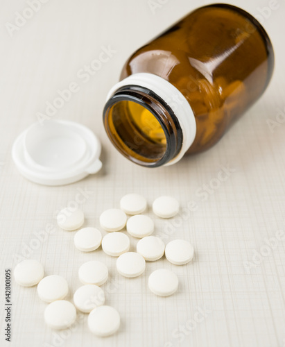 tablets and pills on the white table