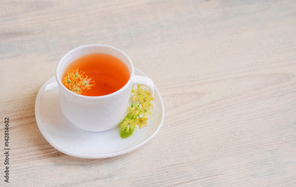 linden tea in a white cup on a light background, linden tea in a white cup on a light background,