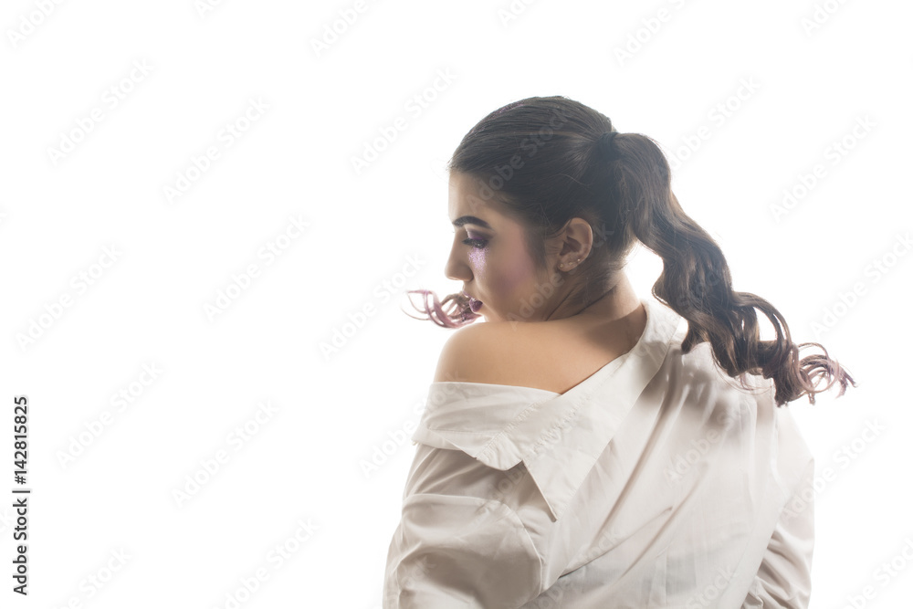 Young girl with two pony tails and artistic make up on  white  background 