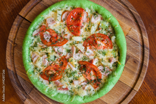 Pizza with chicken pineapple and green dough