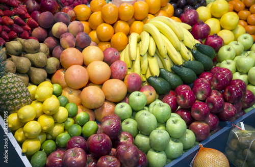 Fototapeta Naklejka Na Ścianę i Meble -  Close up of many colorful fruits on farmers market stand