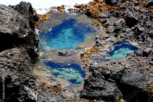 Water pools Pools of water form in the rocky crevices in Naftan, Saipan.