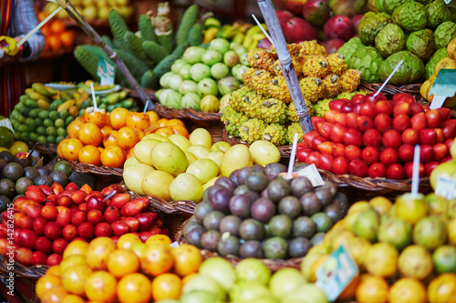Fresh and ripe exotic fruits on traditional farmer market on Madeira