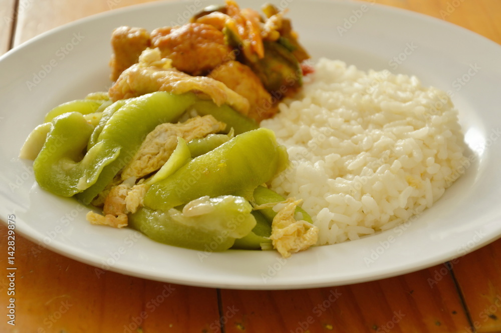 stir fried gourd with egg and spicy fish ball on rice stir fried gourd with egg and spicy fish ball on rice