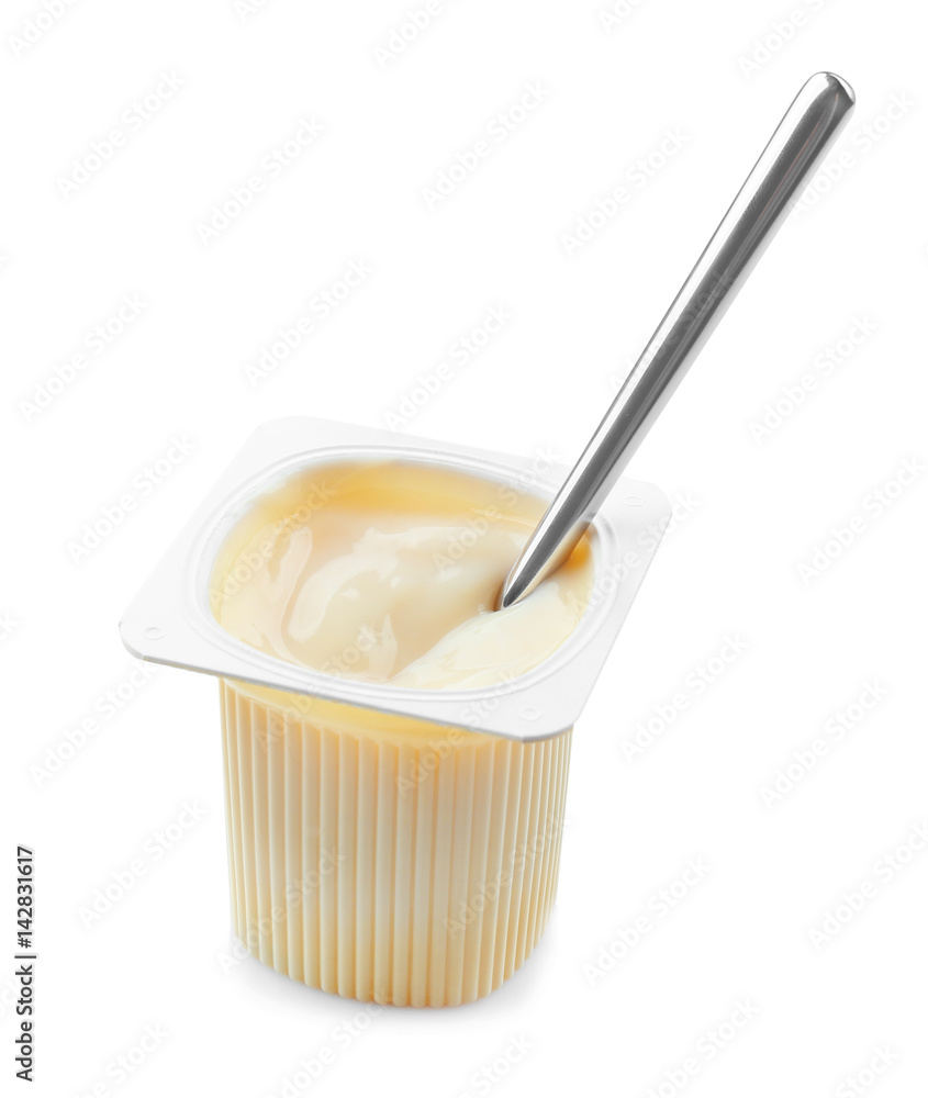 Plastic cup with yogurt and spoon on white background Plastic cup with yogurt and spoon on white background