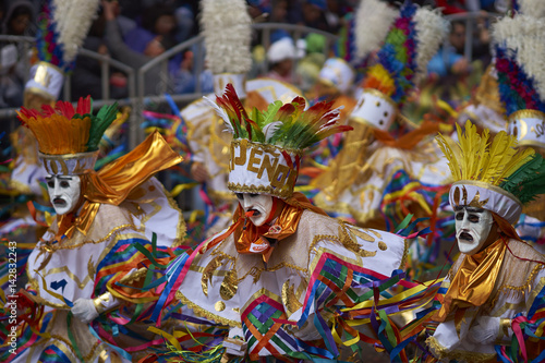 Tobas dancers in colourful costumes performing at the annual Oruro Carnival. The event is designated by UNESCO as being Intangible Cultural Heritage of Humanity. photo