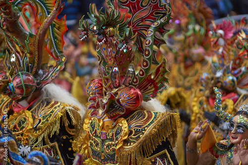 Masked Diablada dancers in ornate costumes parade through the mining city of Oruro on the Altiplano of Bolivia during the annual carnival.