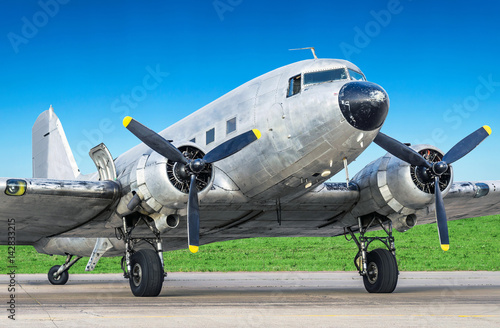 Vintage turboprop airplane parked at the airport