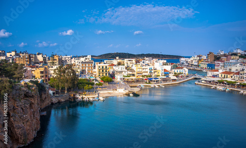 The lake Voulismeni in Agios Nikolaos   a picturesque coastal town with colorful buildings around the port in the eastern part of the island Crete  Greece