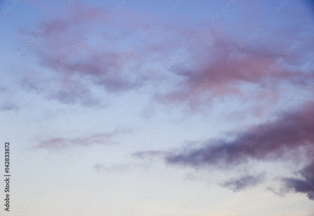 Gray rare clouds on blue sky