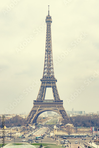 The Eiffel tower is one of the most recognizable landmarks in the world under sun light,selective focus,vintage color