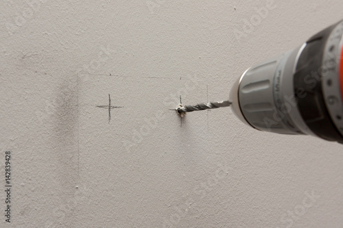 drilling hole in a wall