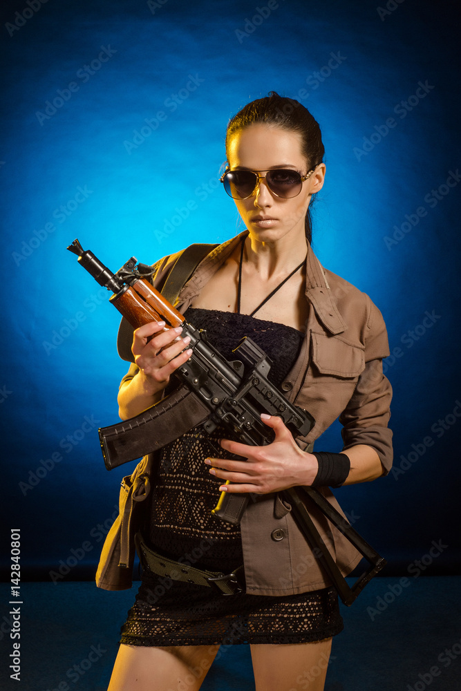 Young woman soldiers with guns