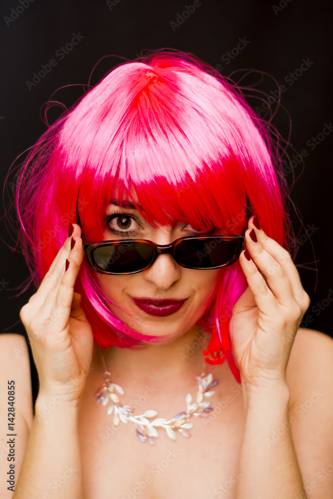 Beauty Woman With Pink Wig And Sunglasses Over Black Background Beauty Woman With Pink Wig And Sunglasses Over Black Background