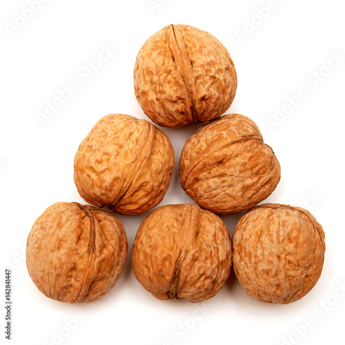 Dry walnuts in shell isolated on white background. Flat lay, top view