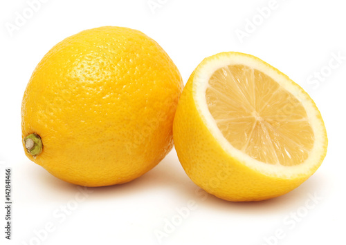 The cut lemon isolated on white background. Tropical fruit. Flat lay, top view
