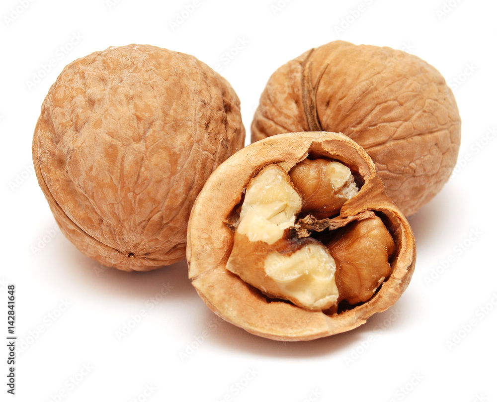 Dry walnuts in shell isolated on white background. Flat lay, top view Dry walnuts in shell isolated on white background. Flat lay, top view
