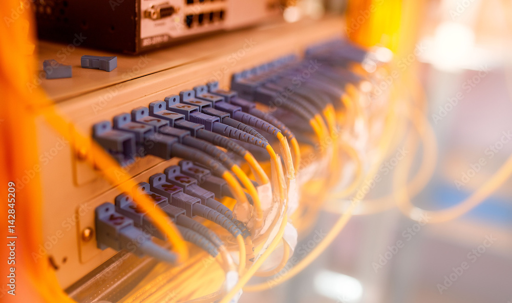 Fiber Optic cables connected to an optic ports and UTP Network cables