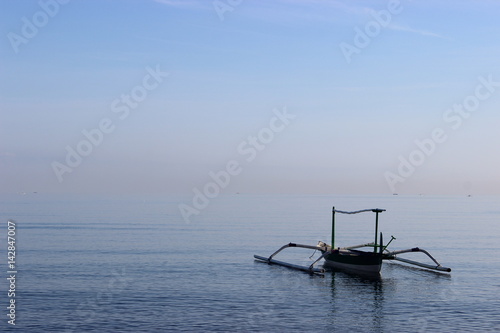 fishing boat alone in the early morning