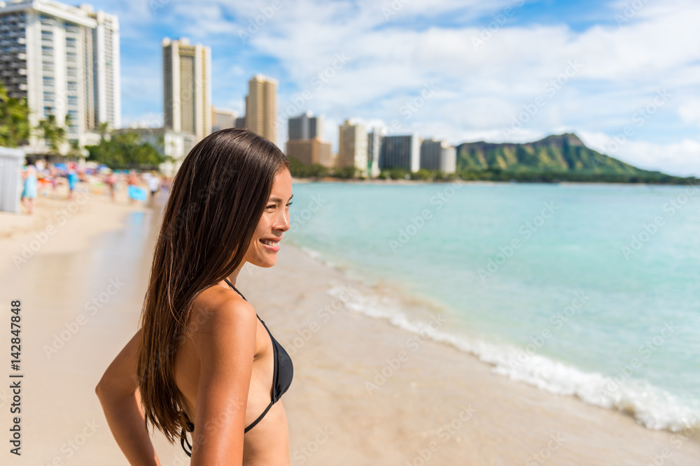 Happy Asian bikini woman enjoying holidays on Waikiki beach in Honolulu  city, Oahu, with diamond head mountain landscape in the background.  Multiracial girl sunbathing on Hawaii summer vacation. Stock Photo | Adobe