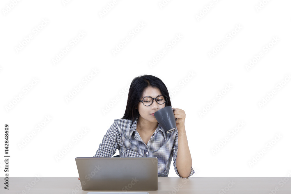 Businesswoman with computer and coffee on studio Businesswoman with computer and coffee on studio