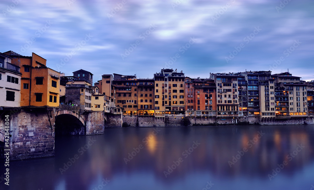 Ponte Vecchio bridge over the river Arno. Bridge was opened in 1345 and is one of the biggest tourist attractions in Florence. Italy