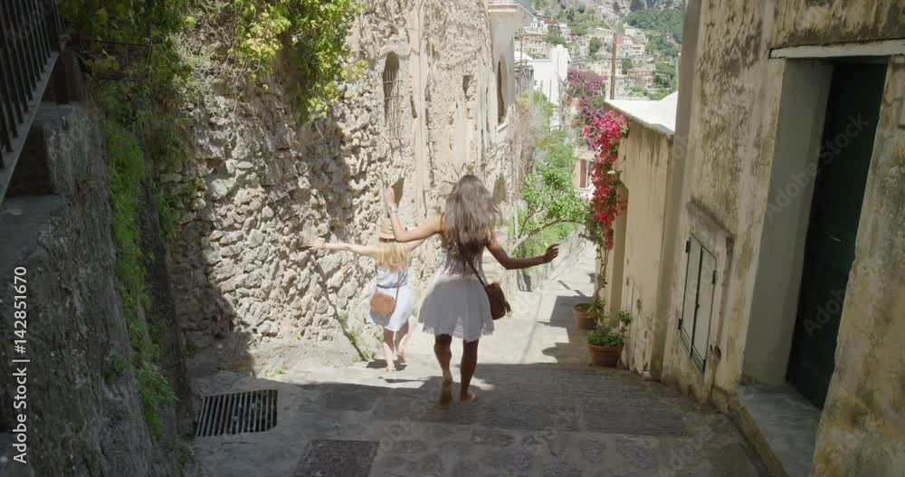 Girl friends walking in Italian street exploring European town Tourist women travelling in beautiful Italy Best friends enjoying summer vacation travel adventure Girl friends walking in Italian street exploring European town Tourist women travelling in beautiful Italy Best friends enjoying summer vacation travel adventure