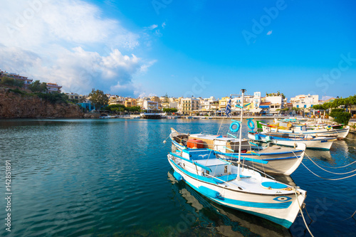 The lake Voulismeni in Agios Nikolaos, a picturesque coastal town with colorful buildings around the port in the eastern part of the island Crete, Greece