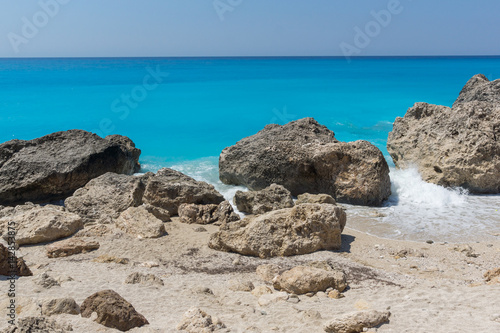 Amazing seascape of blue waters of Megali Petra Beach, Lefkada, Ionian Islands, Greece © Stoyan Haytov