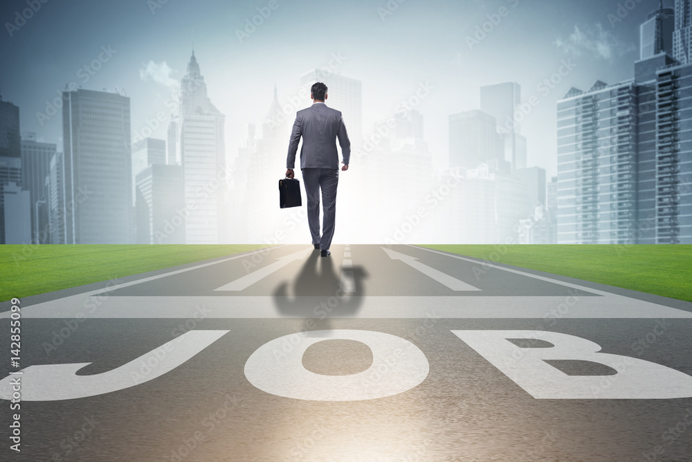 Businessman walking towards his career aspirations Businessman walking towards his career aspirations