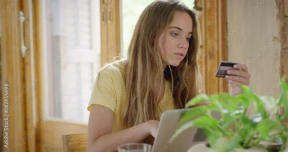Beautiful woman online banking using smartphone shopping online with credit card at home lifestyle Beautiful woman online banking using smartphone shopping online with credit card at home lifestyle